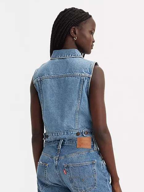 Levis A74370000 Womens XS Vest With Waistband Medium Wash Denim front view on model. If you need any assistance with this item or the purchase of this item please call us at five six one seven four eight eight eight zero one Monday through Saturday 10:00a.m EST to 8:00 p.m EST