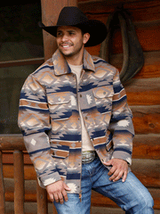 Cinch MWJ1572003 Mens Southwestern Print Frontier Coat Brown on model outdoors. If you need any assistance with this item or the purchase of this item please call us at five six one seven four eight eight eight zero one Monday through Saturday 10:00a.m EST to 8:00 p.m EST