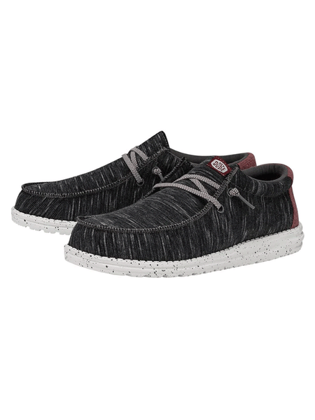 Hey Dude 40169-001 Mens Wally Jersey Shoe Black front and side view . If you need any assistance with this item or the purchase of this item please call us at five six one seven four eight eight eight zero one Monday through Saturday 10:00a.m EST to 8:00 p.m EST