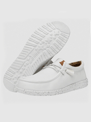 Hey Dude 40296-100 Mens Wally Washed Canvas Shoe White sole and side view. If you need any assistance with this item or the purchase of this item please call us at five six one seven four eight eight eight zero one Monday through Saturday 10:00a.m EST to 8:00 p.m EST