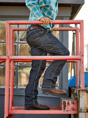 Ariat 10030263 Mens FR M4 Relaxed Stretch Duralight Workhorse Stackable Straight Leg Jean Dark Wash side view. If you need any assistance with this item or the purchase of this item please call us at five six one seven four eight eight eight zero one Monday through Saturday 10:00a.m EST to 8:00 p.m EST