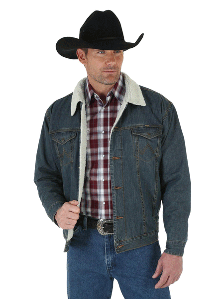 Wrangler 74256RT Mens Western Sherpa Lined Denim Trucker Jacket Rustic front view on model. If you need any assistance with this item or the purchase of this item please call us at five six one seven four eight eight eight zero one Monday through Saturday 10:00a.m EST to 8:00 p.m EST
