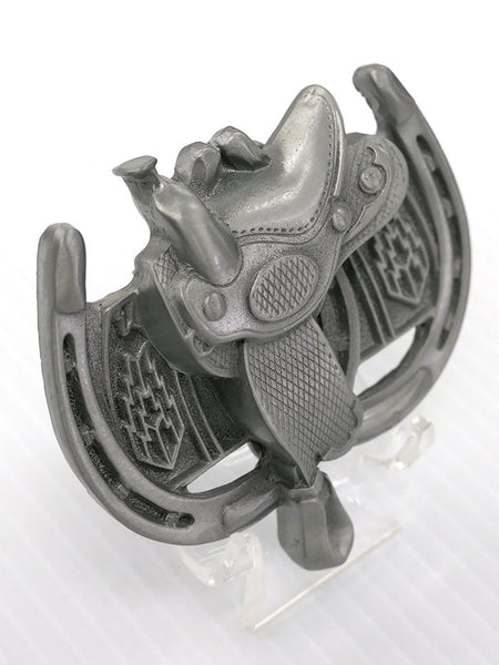 Spec Cast 1964 Horseshoe and Saddle Solid Pewter Belt Buckle  side and front close up view. If you need any assistance with this item or the purchase of this item please call us at five six one seven four eight eight eight zero one Monday through Saturday 10:00a.m EST to 8:00 p.m EST