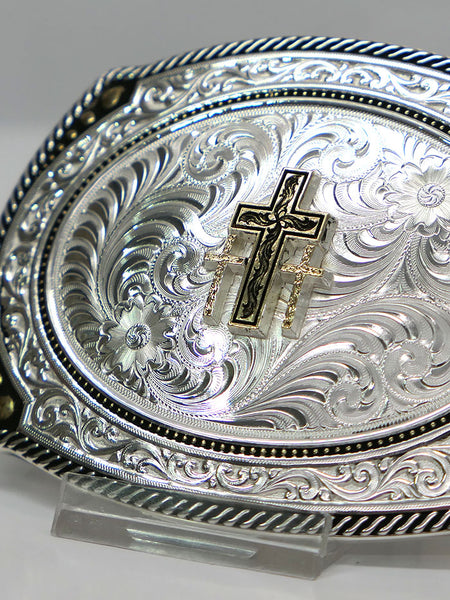 Montana Silversmiths 31210-855 Triple Cross Figure Two Tone Roped Cameo Buckle Silver close up. If you need any assistance with this item or the purchase of this item please call us at five six one seven four eight eight eight zero one Monday through Saturday 10:00a.m EST to 8:00 p.m EST