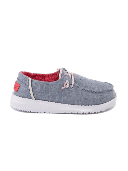 Hey Dude 130125704 Wendy Youth Shoe Chambray Braid side view. If you need any assistance with this item or the purchase of this item please call us at five six one seven four eight eight eight zero one Monday through Saturday 10:00a.m EST to 8:00 p.m EST