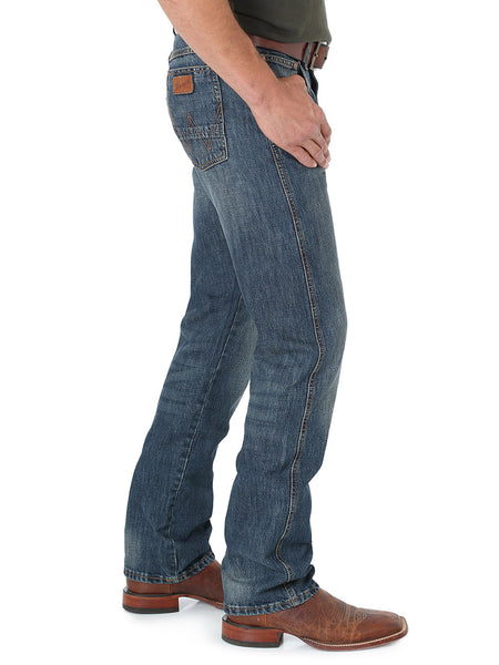 Wrangler 88MWZDK Mens Retro Jean Slim Straight Dark Knight side view. If you need any assistance with this item or the purchase of this item please call us at five six one seven four eight eight eight zero one Monday through Saturday 10:00a.m EST to 8:00 p.m EST