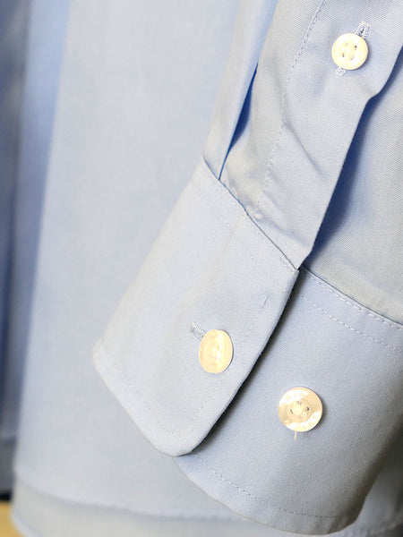 Ariat 10020329 Mens Wrinkle Free Solid Shirt Light Blue cuff close up. If you need any assistance with this item or the purchase of this item please call us at five six one seven four eight eight eight zero one Monday through Saturday 10:00a.m EST to 8:00 p.m EST