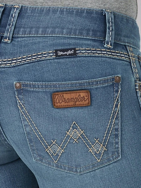 Wrangler 07MWZUG Womens Retro Sadie Bootcut Jeans Medium Wash back pocket close up. If you need any assistance with this item or the purchase of this item please call us at five six one seven four eight eight eight zero one Monday through Saturday 10:00a.m EST to 8:00 p.m EST