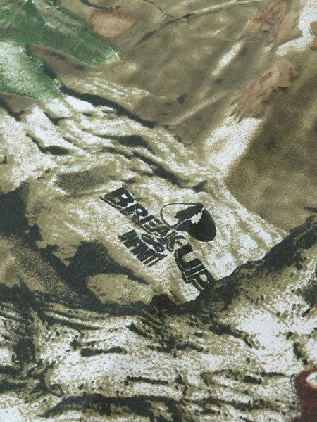 Mossy Oak Camouflage Infinity Bandana 21" fabric close up. If you need any assistance with this item or the purchase of this item please call us at five six one seven four eight eight eight zero one Monday through Saturday 10:00a.m EST to 8:00 p.m EST