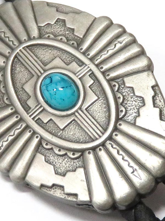 Double S 22114 Southwestern Oval Concho Turquoise Stone Bolo Tie Silver close up. If you need any assistance with this item or the purchase of this item please call us at five six one seven four eight eight eight zero one Monday through Saturday 10:00a.m EST to 8:00 p.m EST