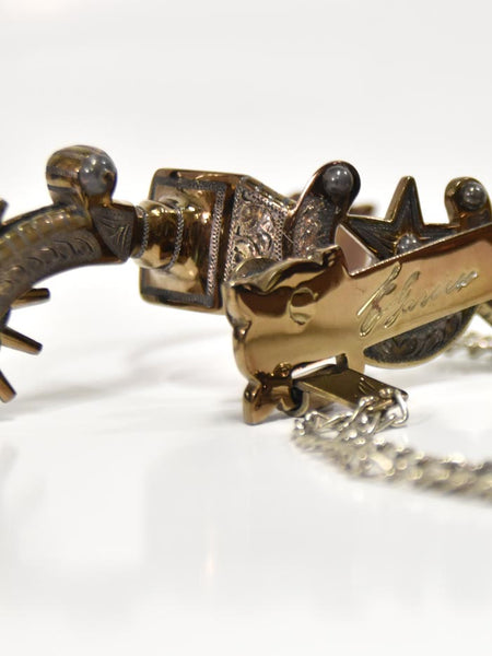 E Garcia Spurs SP2231 Authentic Horseshoe and Star Cowboy Boot Spurs signature close up view. If you need any assistance with this item or the purchase of this item please call us at five six one seven four eight eight eight zero one Monday through Saturday 10:00a.m EST to 8:00 p.m EST