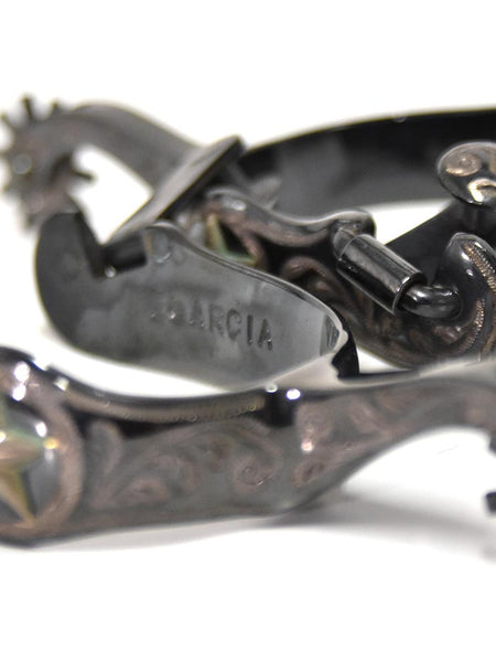 E Garcia Spurs SP2281 Authentic Gun Metal Star Inlay Cowboy Boot Spurs signature close up view. If you need any assistance with this item or the purchase of this item please call us at five six one seven four eight eight eight zero one Monday through Saturday 10:00a.m EST to 8:00 p.m EST