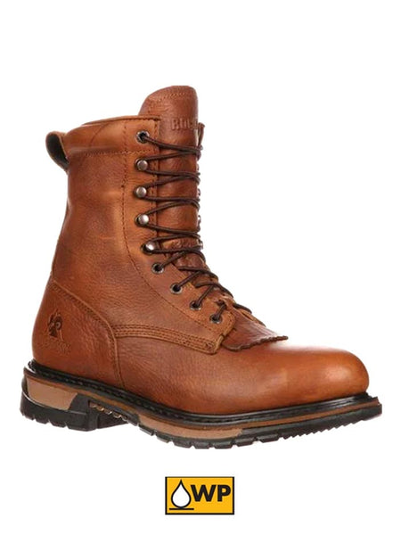 Rocky FQ0002723 Mens Original Ride Lacer Waterproof Boots Tan Pitstop side and front view. If you need any assistance with this item or the purchase of this item please call us at five six one seven four eight eight eight zero one Monday through Saturday 10:00a.m EST to 8:00 p.m EST