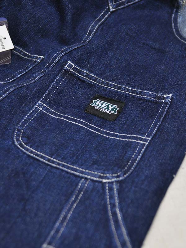 Key Industries KEY001 Kids Premium Washed Denim Overall Navy front view different sizes. If you need any assistance with this item or the purchase of this item please call us at five six one seven four eight eight eight zero one Monday through Saturday 10:00a.m EST to 8:00 p.m EST