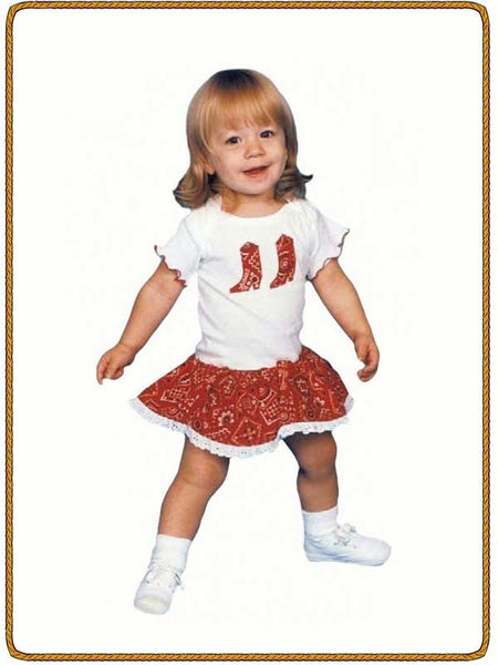 Kiddie Korral 11R Girls Cowgirl Onesie Ruffled Red front view on model. If you need any assistance with this item or the purchase of this item please call us at five six one seven four eight eight eight zero one Monday through Saturday 10:00a.m EST to 8:00 p.m EST