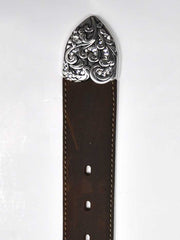 Tony Lama C50499 Womens Kaitlyn Crystal Western Leather Belt Brown tip close up. If you need any assistance with this item or the purchase of this item please call us at five six one seven four eight eight eight zero one Monday through Saturday 10:00a.m EST to 8:00 p.m EST