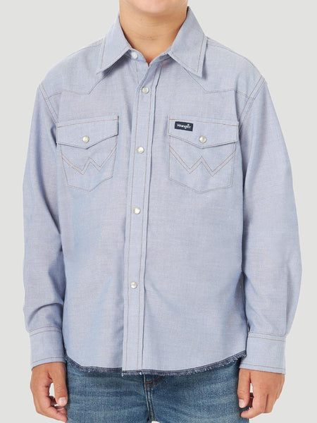 Wrangler BW7013B Boy's Cowboy Cut Western Snap Shirt Blue Chambray front view. If you need any assistance with this item or the purchase of this item please call us at five six one seven four eight eight eight zero one Monday through Saturday 10:00a.m EST to 8:00 p.m EST