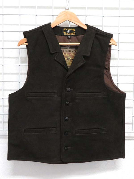 Wyoming Traders Mens Buffalo Leather Vests Chocolate front view hanging. If you need any assistance with this item or the purchase of this item please call us at five six one seven four eight eight eight zero one Monday through Saturday 10:00a.m EST to 8:00 p.m EST