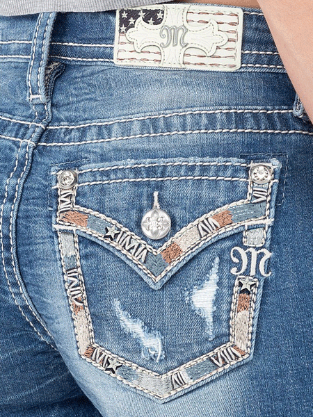 Miss Me M3894H Womens Mid-Rise Short Dark Blue back pocker close up. If you need any assistance with this item or the purchase of this item please call us at five six one seven four eight eight eight zero one Monday through Saturday 10:00a.m EST to 8:00 p.m EST
