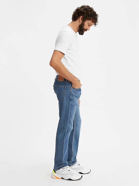 Levi’s 005052217 Mens 505 Regular Fit Stretch Jeans Fremont Drop Shot - Medium Wash side view. If you need any assistance with this item or the purchase of this item please call us at five six one seven four eight eight eight zero one Monday through Saturday 10:00a.m EST to 8:00 p.m EST