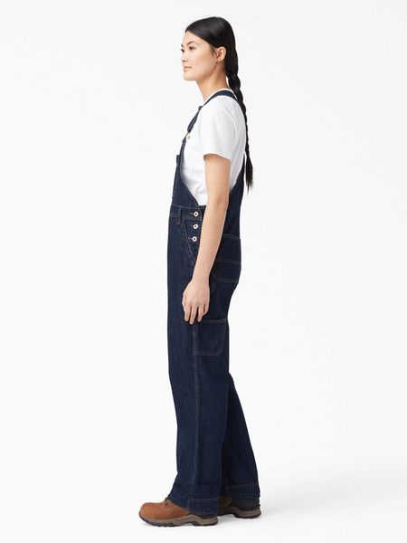 Dickies FB206DIB Womens Relaxed Fit Bib Overalls Dark Indigo side view. If you need any assistance with this item or the purchase of this item please call us at five six one seven four eight eight eight zero one Monday through Saturday 10:00a.m EST to 8:00 p.m EST