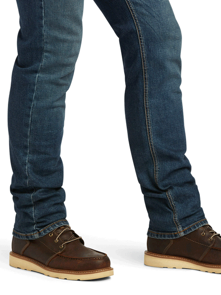 Ariat 10039625 Mens M8 Modern TekStretch Sebastian Slim Leg Jean Grafton leg bottom close up. If you need any assistance with this item or the purchase of this item please call us at five six one seven four eight eight eight zero one Monday through Saturday 10:00a.m EST to 8:00 p.m EST