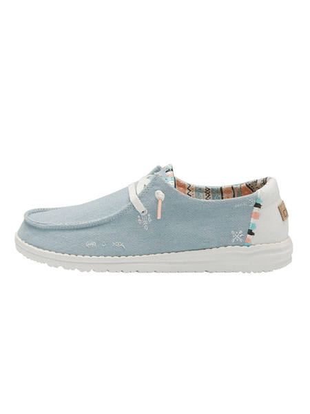 Hey Dude 121412412 Womens Wendy Boho Shoe Light Denim side view. If you need any assistance with this item or the purchase of this item please call us at five six one seven four eight eight eight zero one Monday through Saturday 10:00a.m EST to 8:00 p.m EST