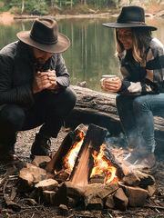 Stetson TWBOZE-813007 Bozeman Outdoor Crushable Felt Hat Black models wearing hat by campfire. If you need any assistance with this item or the purchase of this item please call us at five six one seven four eight eight eight zero one Monday through Saturday 10:00a.m EST to 8:00 p.m EST