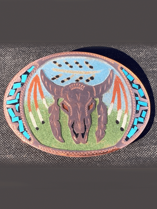 Colorado Silver Star 0-NA-SF-12 Skull and Feathers Sandpainted Handcrafted Oval Buckle Copper front view. If you need any assistance with this item or the purchase of this item please call us at five six one seven four eight eight eight zero one Monday through Saturday 10:00a.m EST to 8:00 p.m EST