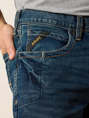 Ariat 10016220 Mens Rebar M4 Relaxed DuraStretch Edge Boot Cut Jean Bodie Navy front pocket close up. If you need any assistance with this item or the purchase of this item please call us at five six one seven four eight eight eight zero one Monday through Saturday 10:00a.m EST to 8:00 p.m EST