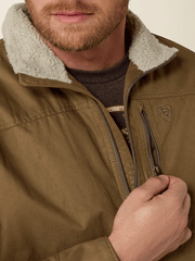 Ariat 10028399 Mens Grizzly Canvas Concealed Carry Jacket Cub chest pocket close up. If you need any assistance with this item or the purchase of this item please call us at five six one seven four eight eight eight zero one Monday through Saturday 10:00a.m EST to 8:00 p.m EST