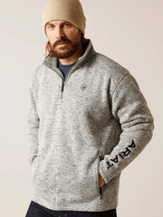 Ariat 10046490 Mens Caldwell Logo Zip Sweater Nulla Heather front view. If you need any assistance with this item or the purchase of this item please call us at five six one seven four eight eight eight zero one Monday through Saturday 10:00a.m EST to 8:00 p.m EST