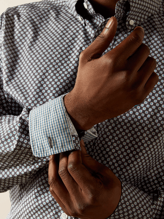 Ariat 10062228 Mens Wrinkle Free Caleb Classic Fit Shirt Dark Grey cuff close up. If you need any assistance with this item or the purchase of this item please call us at five six one seven four eight eight eight zero one Monday through Saturday 10:00a.m EST to 8:00 p.m EST