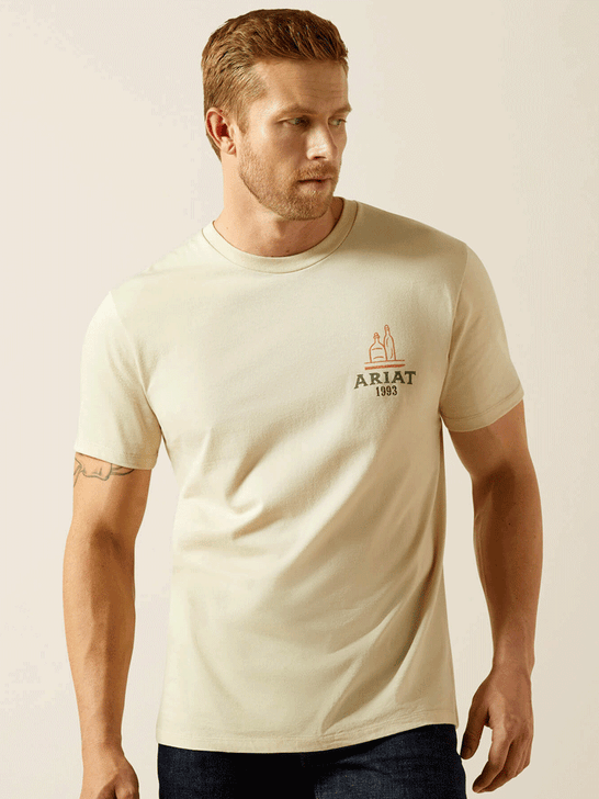 Ariat 10062424 Mens Mezcal Mezclilla T-Shirt Natural front view. If you need any assistance with this item or the purchase of this item please call us at five six one seven four eight eight eight zero one Monday through Saturday 10:00a.m EST to 8:00 p.m EST