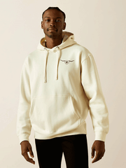 Ariat 10062499 Mens Shield Steerhead Hoodie Oatmeal front view. If you need any assistance with this item or the purchase of this item please call us at five six one seven four eight eight eight zero one Monday through Saturday 10:00a.m EST to 8:00 p.m EST