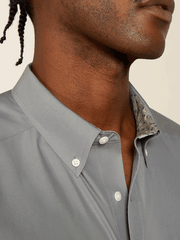 Ariat 10062526 Mens Wrinkle Free Solid Pinpoint Oxford Classic Fit Shirt Silver Grey collar close up view. If you need any assistance with this item or the purchase of this item please call us at five six one seven four eight eight eight zero one Monday through Saturday 10:00a.m EST to 8:00 p.m EST