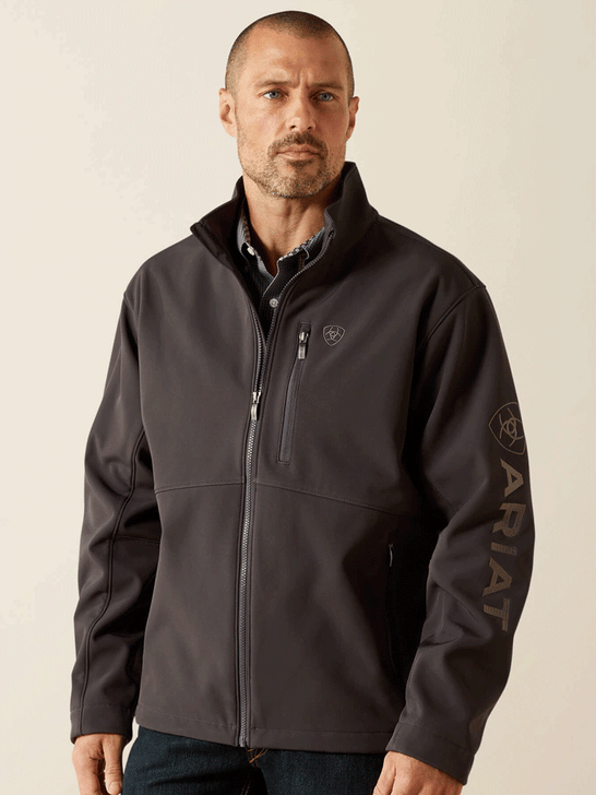 Ariat 10062580 Mens Logo Softshell Jacket Phantom front view. If you need any assistance with this item or the purchase of this item please call us at five six one seven four eight eight eight zero one Monday through Saturday 10:00a.m EST to 8:00 p.m EST