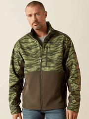 Ariat 10062582 Mens Logo Softshell Jacket Earth Green Camo front view. If you need any assistance with this item or the purchase of this item please call us at five six one seven four eight eight eight zero one Monday through Saturday 10:00a.m EST to 8:00 p.m EST