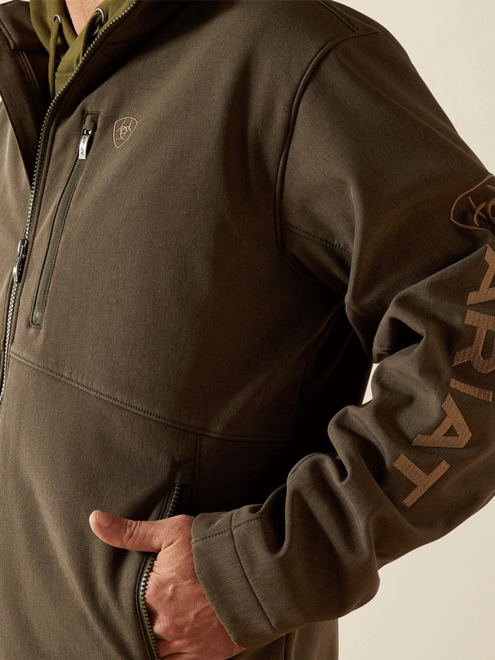 Ariat 10062584 Mens Logo Softshell Jacket Earth Green Heather front view. If you need any assistance with this item or the purchase of this item please call us at five six one seven four eight eight eight zero one Monday through Saturday 10:00a.m EST to 8:00 p.m EST