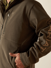 Ariat 10062584 Mens Logo Softshell Jacket Earth Green Heather side view. If you need any assistance with this item or the purchase of this item please call us at five six one seven four eight eight eight zero one Monday through Saturday 10:00a.m EST to 8:00 p.m EST