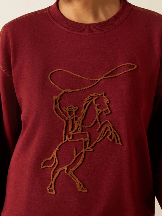 Ariat 10062799 Womens Lasso Sweatshirt Cabarnet Burgundy front close up. If you need any assistance with this item or the purchase of this item please call us at five six one seven four eight eight eight zero one Monday through Saturday 10:00a.m EST to 8:00 p.m EST