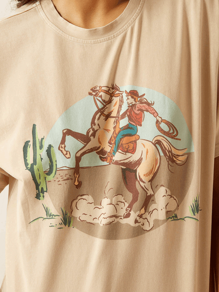 Ariat 10062916 Womens Ride On T-Shirt Natural front close up. If you need any assistance with this item or the purchase of this item please call us at five six one seven four eight eight eight zero one Monday through Saturday 10:00a.m EST to 8:00 p.m EST
