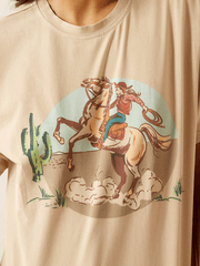 Ariat 10062916 Womens Ride On T-Shirt Natural front close up. If you need any assistance with this item or the purchase of this item please call us at five six one seven four eight eight eight zero one Monday through Saturday 10:00a.m EST to 8:00 p.m EST
