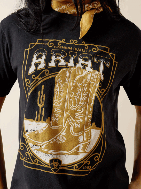 Ariat 10063756 Womens Boot Cloche T-Shirt Black front close up view. If you need any assistance with this item or the purchase of this item please call us at five six one seven four eight eight eight zero one Monday through Saturday 10:00a.m EST to 8:00 p.m EST