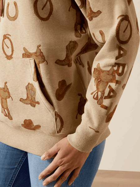 Ariat 10065823 Womens Logo 2.0 Hoodie Savannah Tan Heather sleeve and pocket close up. If you need any assistance with this item or the purchase of this item please call us at five six one seven four eight eight eight zero one Monday through Saturday 10:00a.m EST to 8:00 p.m EST