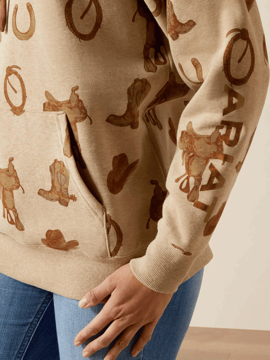 Ariat 10065823 Womens Logo 2.0 Hoodie Savannah Tan Heather sleeve and pocket close up. If you need any assistance with this item or the purchase of this item please call us at five six one seven four eight eight eight zero one Monday through Saturday 10:00a.m EST to 8:00 p.m EST