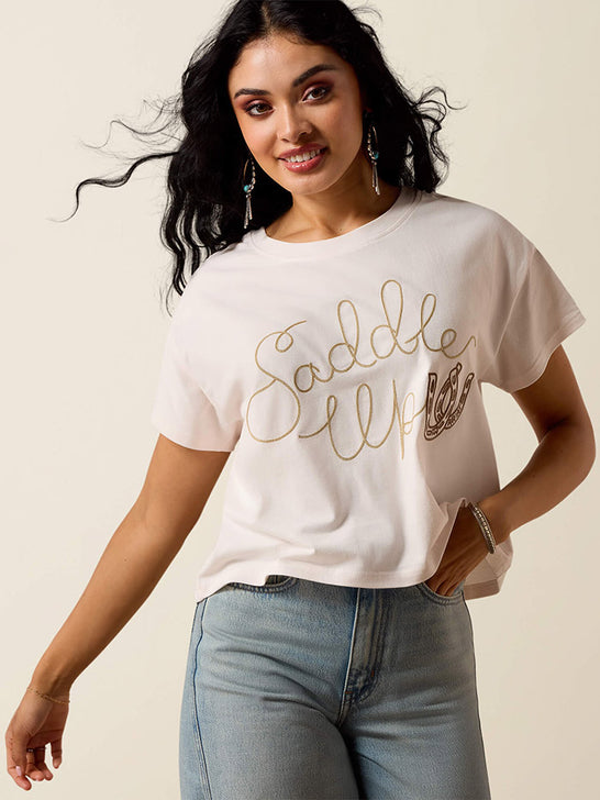 Ariat 10073553 Womens Saddle Up T-Shirt Sea Salt front view. If you need any assistance with this item or the purchase of this item please call us at five six one seven four eight eight eight zero one Monday through Saturday 10:00a.m EST to 8:00 p.m EST