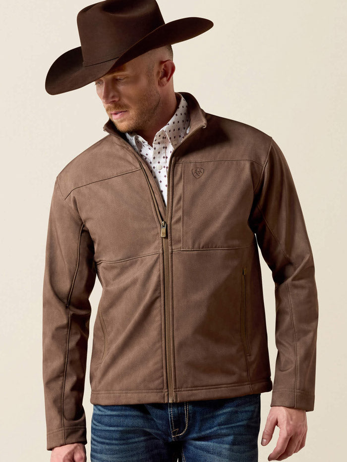 Ariat 10079404 Mens Vernon Softshell Jacket Brown front view zipped. If you need any assistance with this item or the purchase of this item please call us at five six one seven four eight eight eight zero one Monday through Saturday 10:00a.m EST to 8:00 p.m EST
