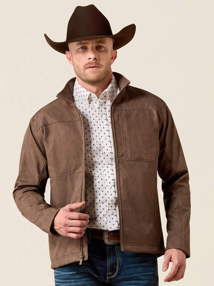 Ariat 10079404 Mens Vernon Softshell Jacket Brown front view zipped. If you need any assistance with this item or the purchase of this item please call us at five six one seven four eight eight eight zero one Monday through Saturday 10:00a.m EST to 8:00 p.m EST
