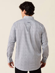 A man viewed from the back wearing a light gray long-sleeve button-up shirt with a subtle speckled pattern and a small black ARIAT logo on the upper back, set against a solid light beige background. If you need any assistance with this item or the purchase of this item please call us at five six one seven four eight eight eight zero one Monday through Saturday 10:00a.m EST to 8:00 p.m EST